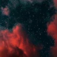 Red clouds framing a starry nightsky