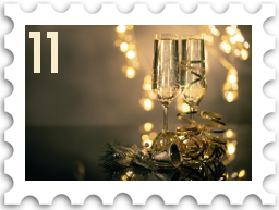 November/December 2021 SWG Challenge Holiday Party stamp - two champagne flutes, half filled, backlit, with gold ribbon curling around the bases