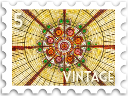 May 2022 Vintage SWG challenge stamp - View of an art deco stained glass dome from directly underneath; the center of the dome is a stylized flower, and rays radiate out horizontally, vertically, and diagonally