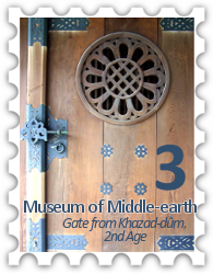 March 2018 Middle-earth Museum SWG challenge stamp - photo of a wooden gate with ornate ironwork and a stylized flower window labelled "Gate from Khazad-dûm, 2nd Age"