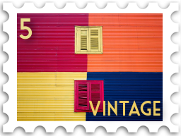 May 2022 Vintage SWG challenge stamp - a colorfully painted wall with 4 blocks of color and two shuttered windows