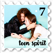 July 2018 Teen Spirit SWG challenge stamp - Photo of a lesbian couple lounging on a bed or sofa