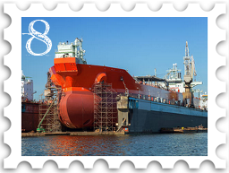 August 2022 Restoration and Rebuilding SWG challenge stamp - color photo of a modern ship in drydock; scaffolding and other equipment is visible around the hull