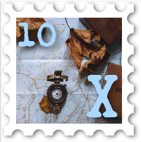 October 2022 X Marks the Spot SWG challenge stamp - color photo of a map, with a compass and autum leaves on top of it; a notebook is in one corner