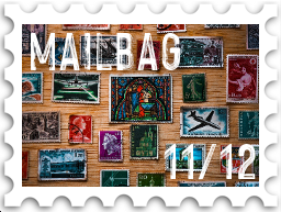 November/December 2022 Manwë's Mailbag SWG challenge stamp - color photo of array of vintage stamps on a wooden background, with the text "Mailbag" and number 11/12