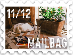November/December 2022 Manwë's Mailbag SWG challenge stamp - color photo of several postcards spread out on a sunny window seat, with the text "Mailbag" and number 11/12
