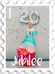 January 2025 Jubilee SWG challenge stamp - photo of a joyous woman in a brightly colored dress with multiple layers of ruffles. Confetti is falling around her, and she stand in front of a silver balloon in the form  of the number 20.