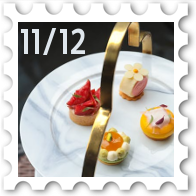 November/December 2025 Great Beleriand Bake-Off SWG challenge stamp - photo of  4 fancy petit fours on the top tier of a serving stand