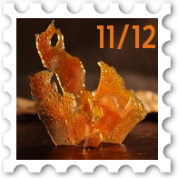 November/December 2025 Great Beleriand Bake-Off SWG challenge stamp - closeup photo of sugar work atop a chocolate-glazed cake