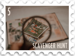 May 2026 Famous Scavenger Hunt SWG challenge  stamp - a color photo of a magnifying glass examining a single stamp in a stamp collection.