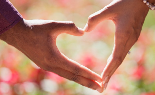 Two hands form a heart shape