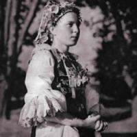 historic photo of a girl in slavic folk costume