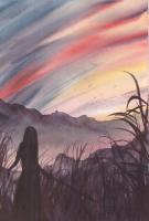 Woman's silhouette against the backdrop of mountains and sky