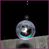 Soap bubble on a grey and black background