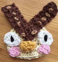 Blather's (Animal Crossing owl character) face crocheted out of yarn 